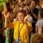 The monitors start the day with joy, singing and dancing.