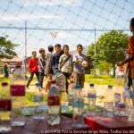 Teens playing a kind of bowling during the Ferias.