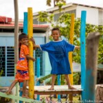 Children playing on the blue wood-made playground.